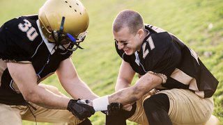What is an AC joint injury, and why is it so common in contact sports?