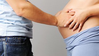 What role does a doula play during and after childbirth?