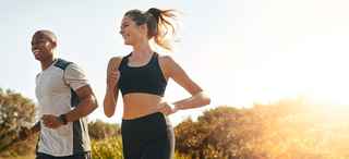 Two people jogging on a sunny day