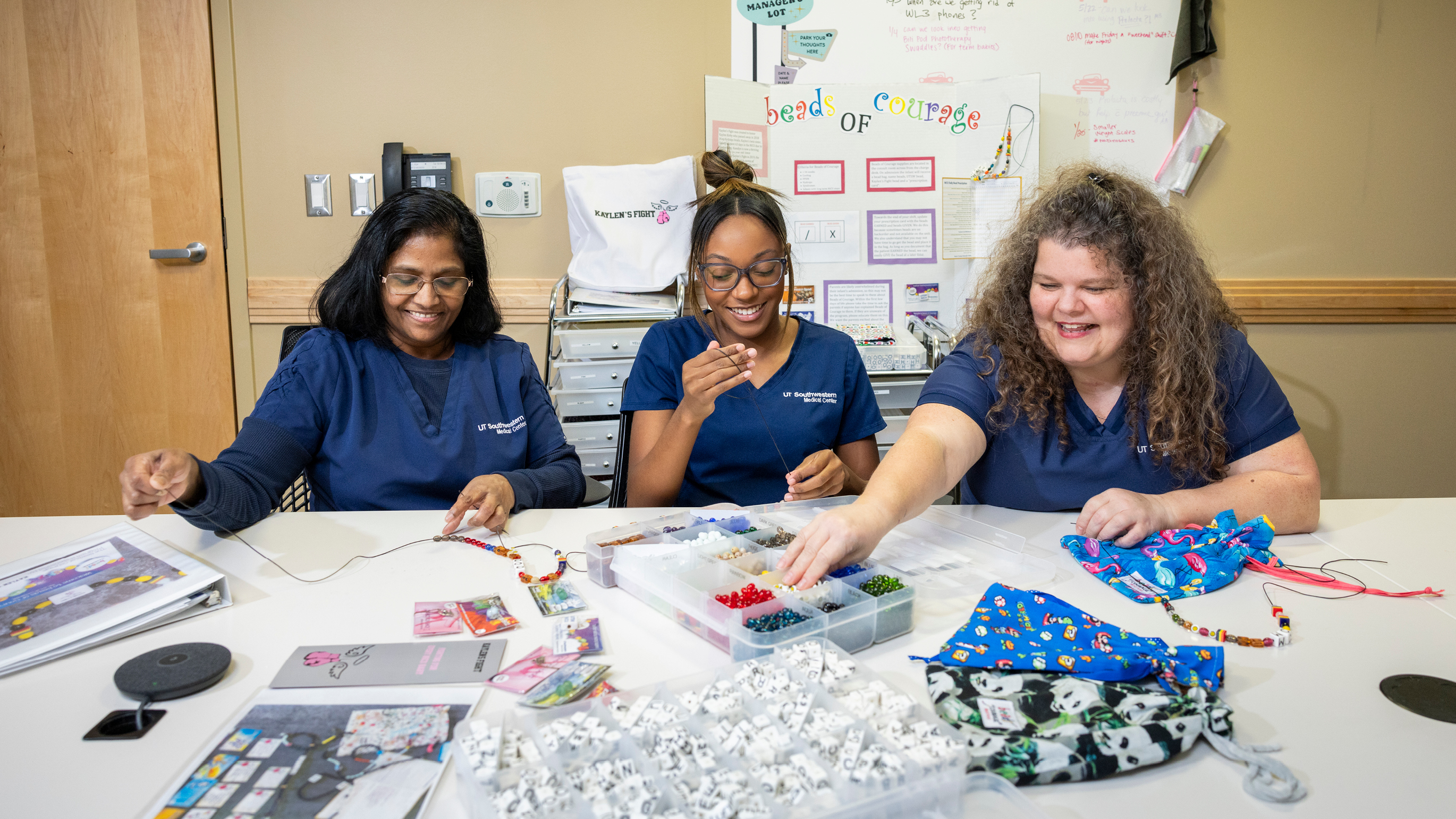 Nurses working on the NICU beads of courage program