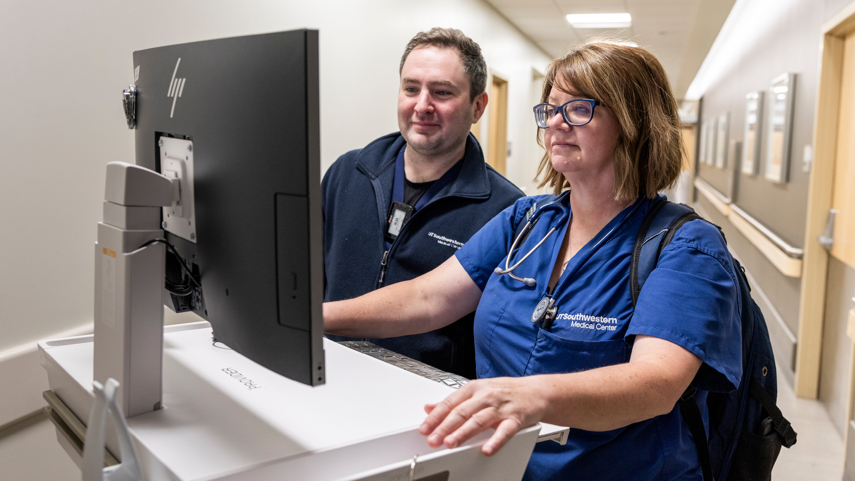 Two nurses looking at a computer.