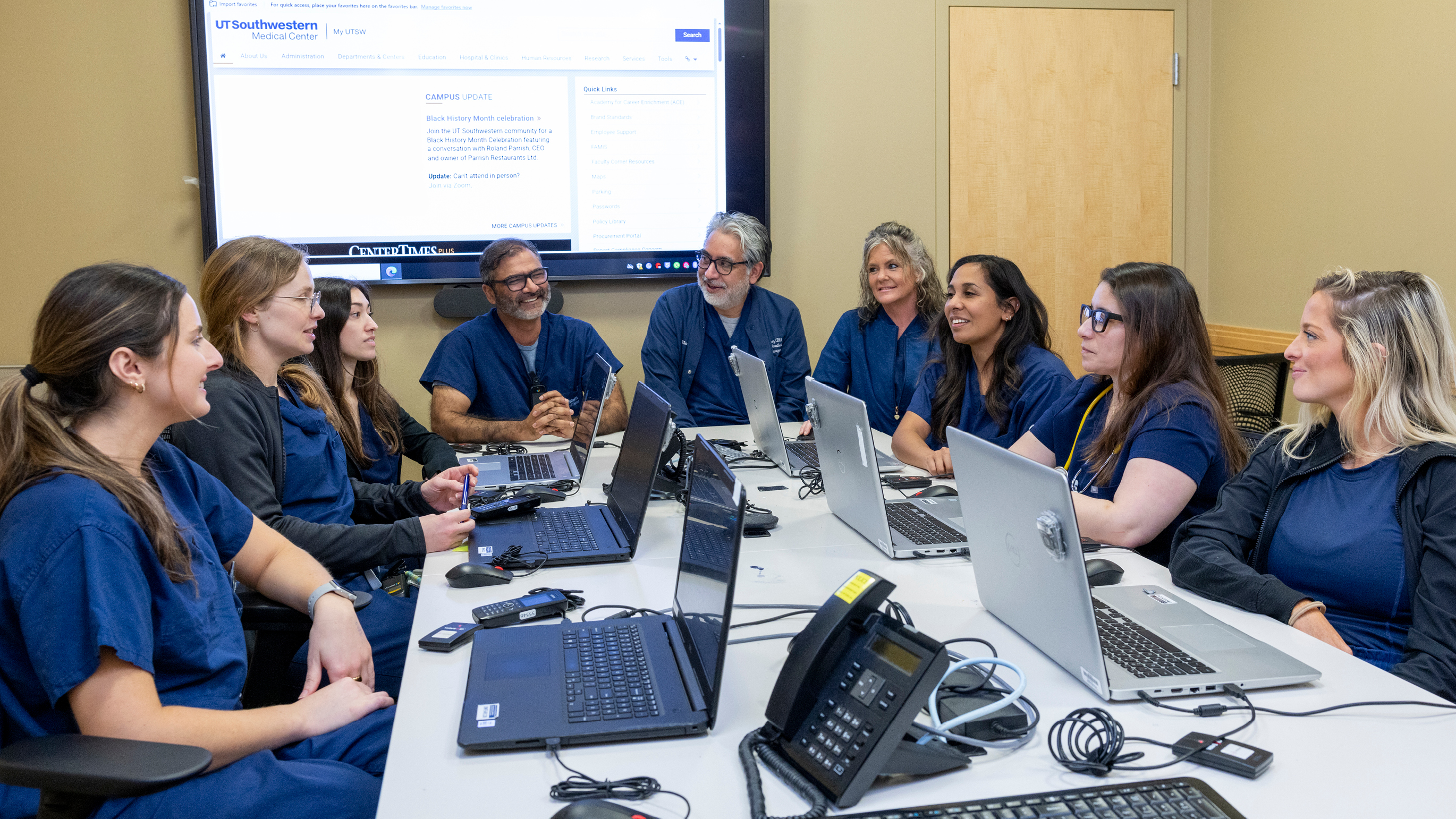 Group of nurses rounding and discussing cases
