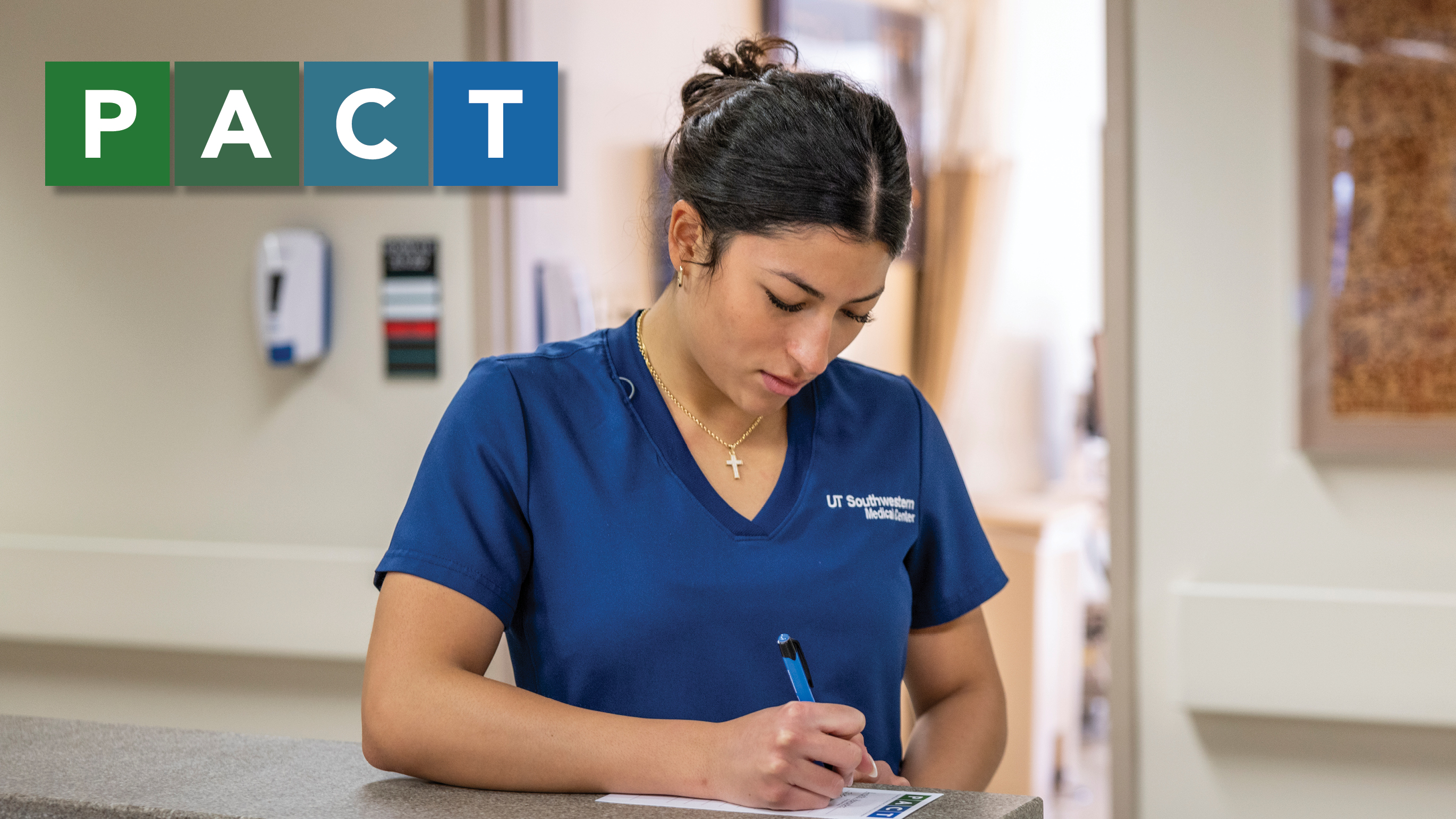 Nurse standing and writing notes with "PACT" in text in the corner