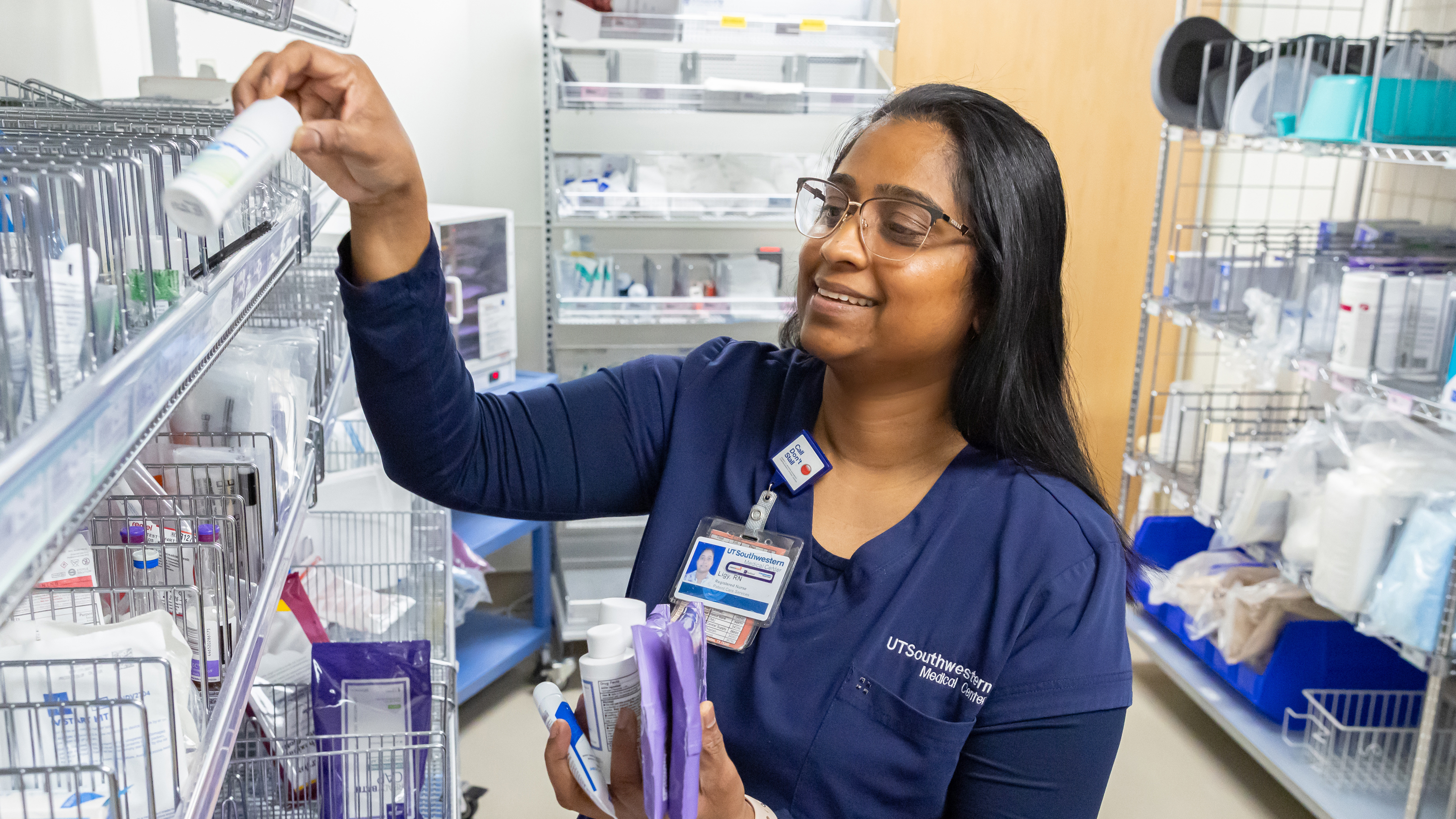 A nurse removes supplies from a shelf with the tagline "Excellence is our starting point...not our finish line." displaying over the image.