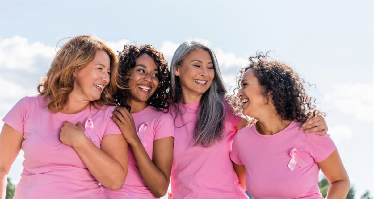 woman in pink shirt looking at camera