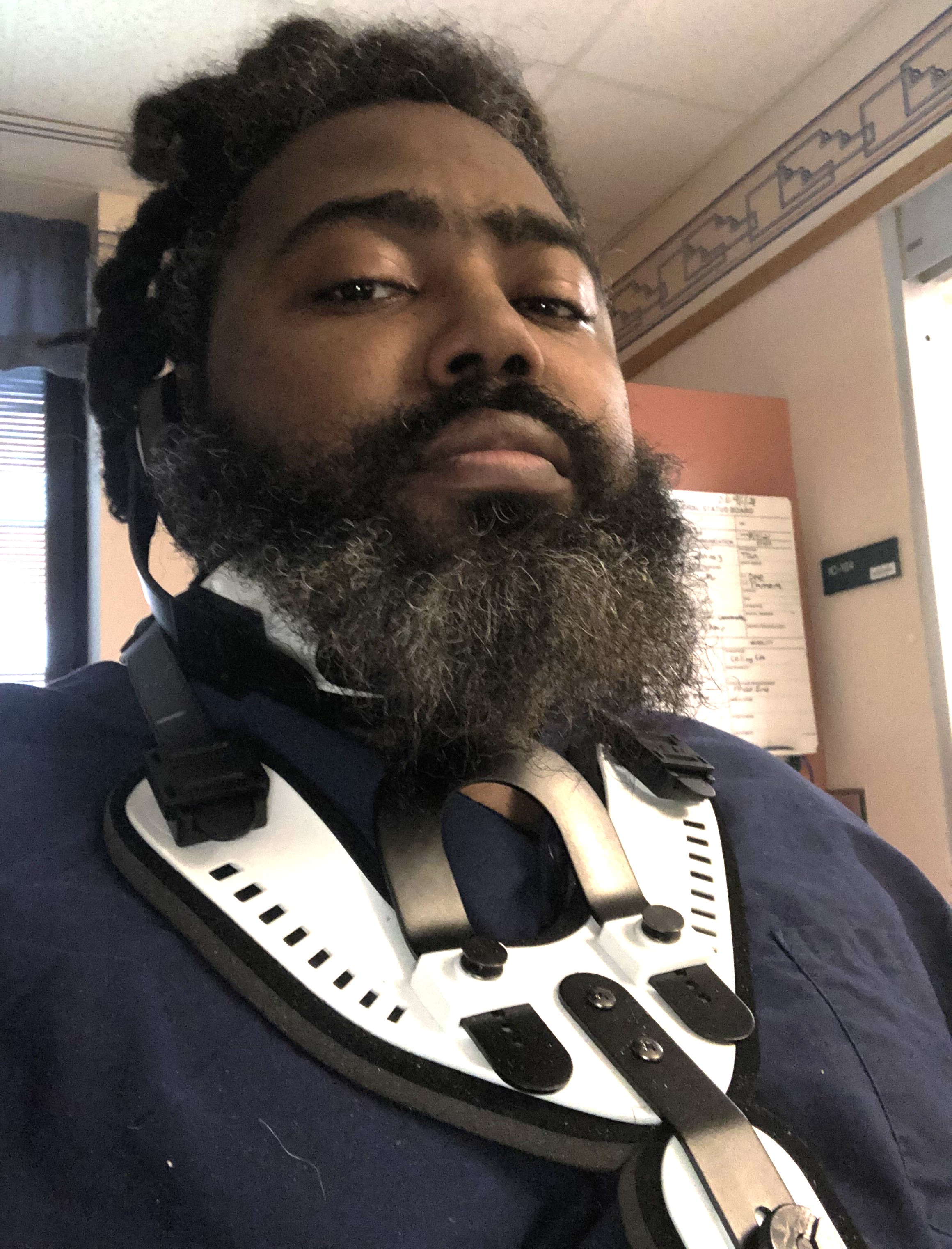 Patient Clinton Adger wearing neck brace