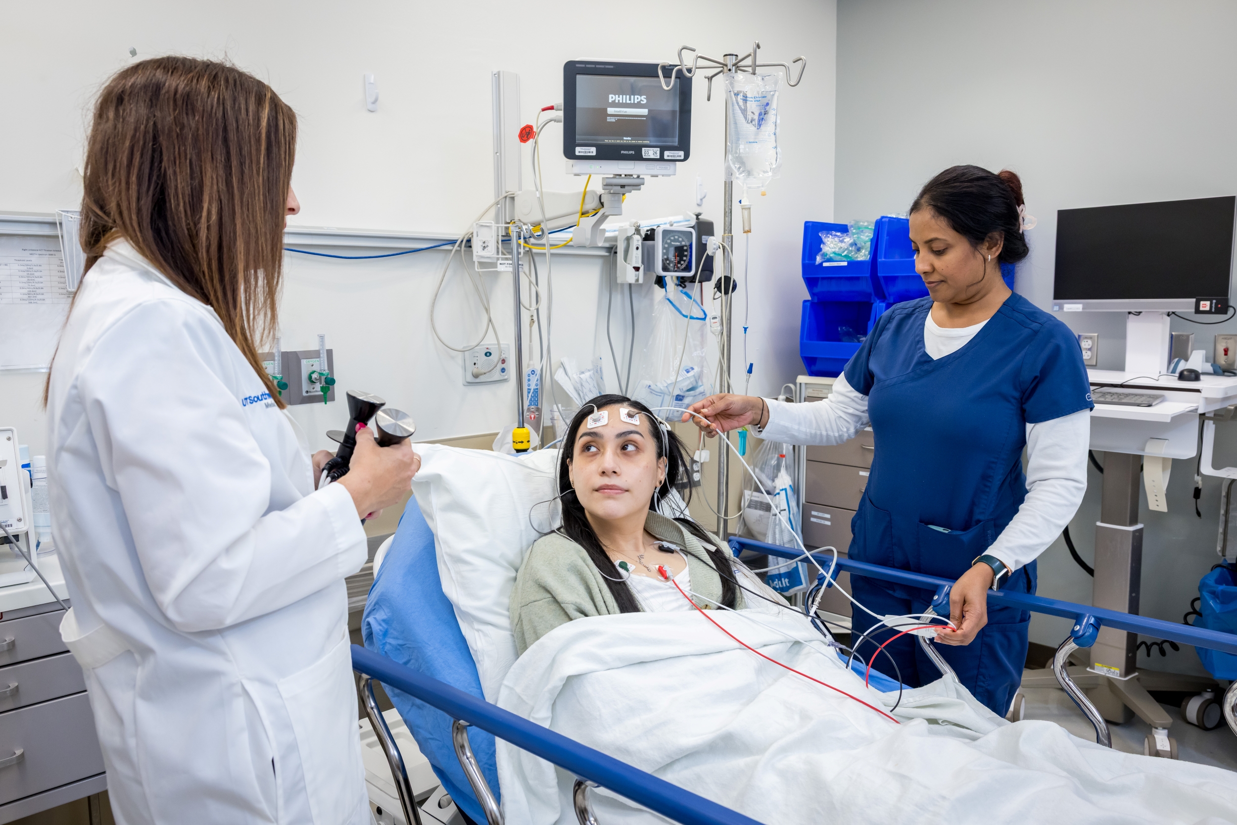 Doctor and nurse talking with patient who will get electroconvulsive therapy