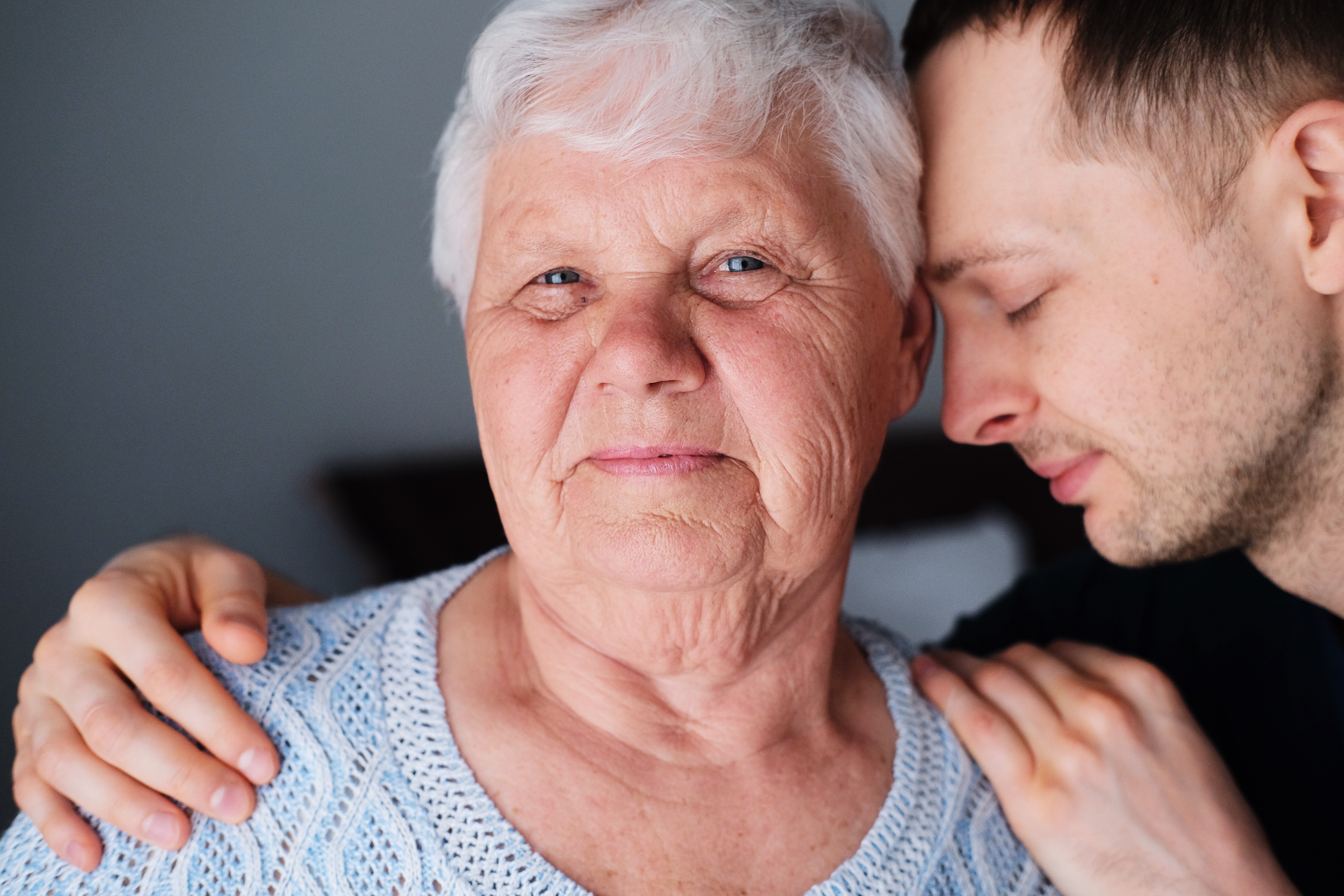 Grandson embracing his grandmother