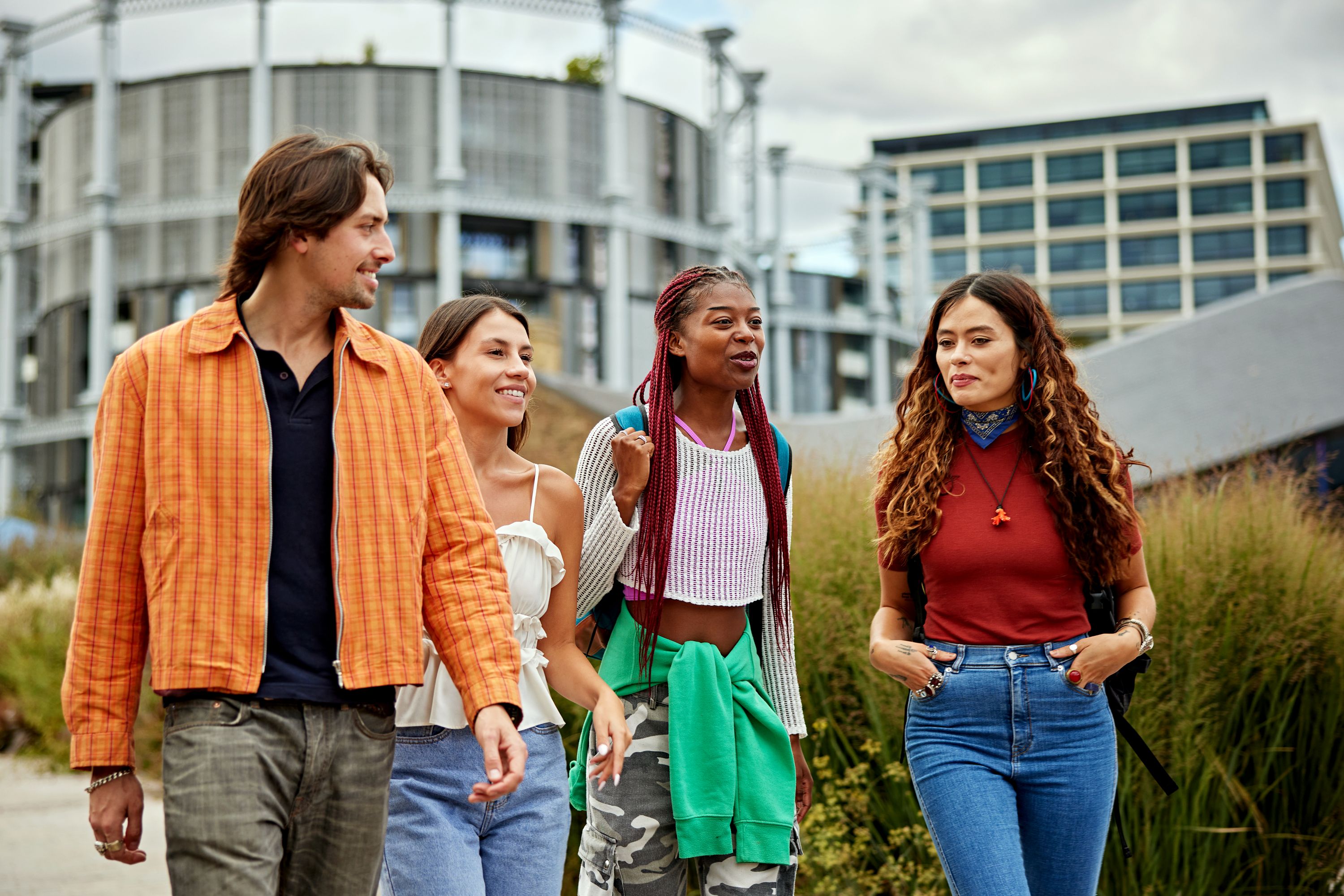 4 young adults walking together