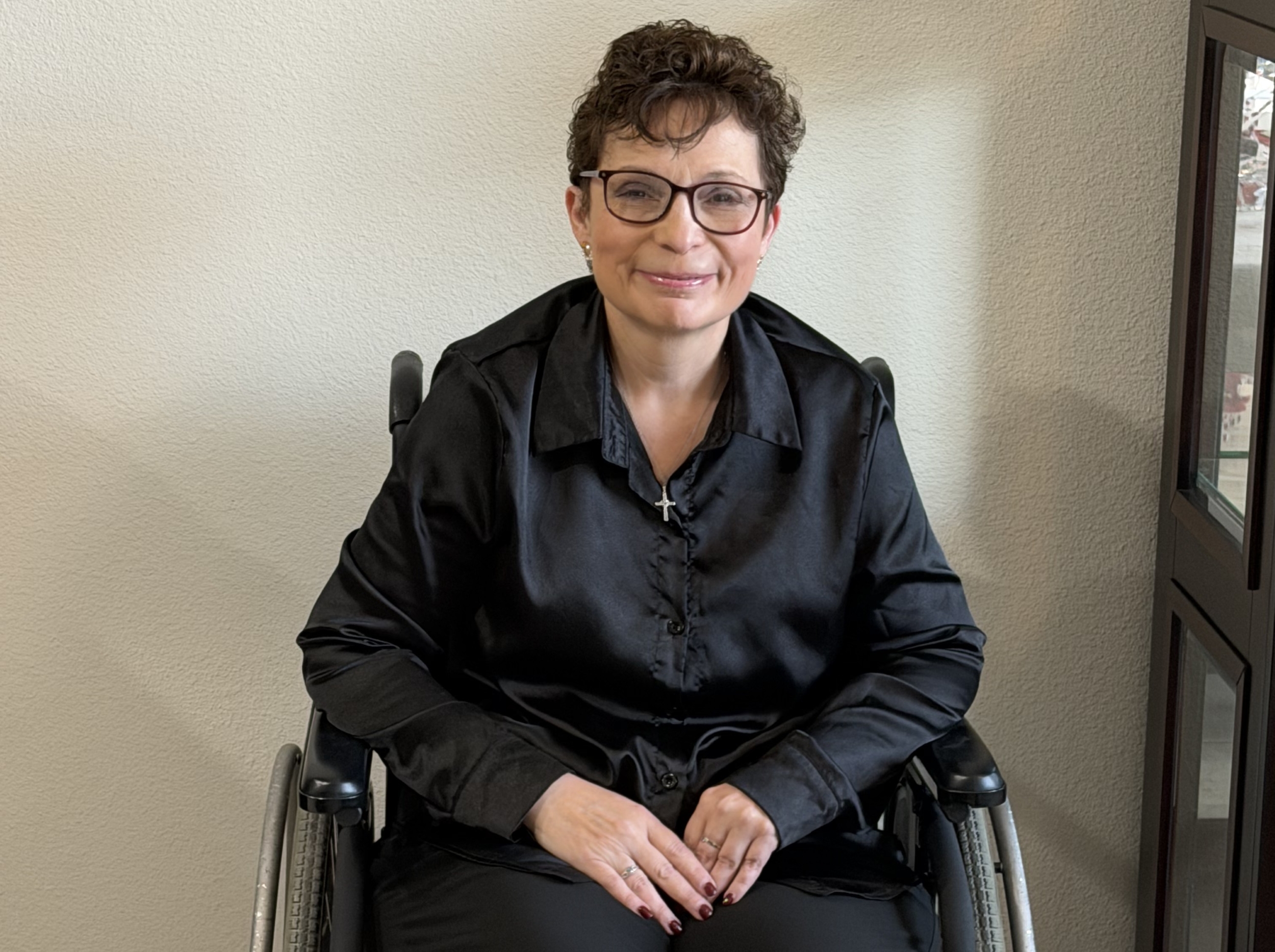 Patient Paige Montgomery sitting in wheelchair
