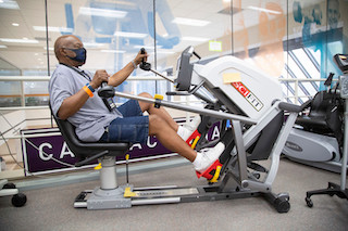 Patient working in the Cardiac Rehabilitation facility on a stationary bike