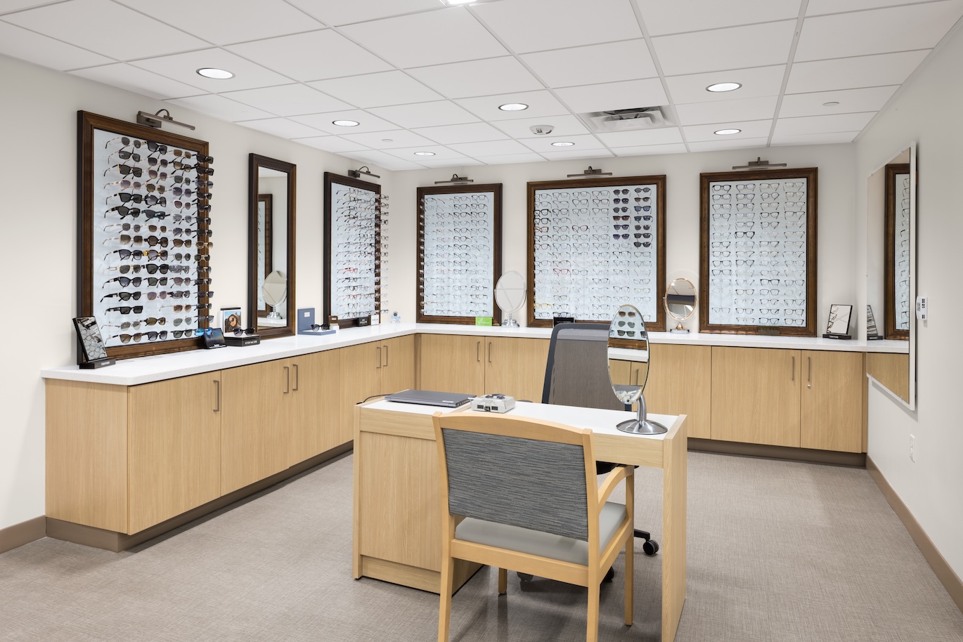 Interior of the optical shop, with frames and a desk