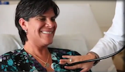 doctor using a stethoscope on a patient