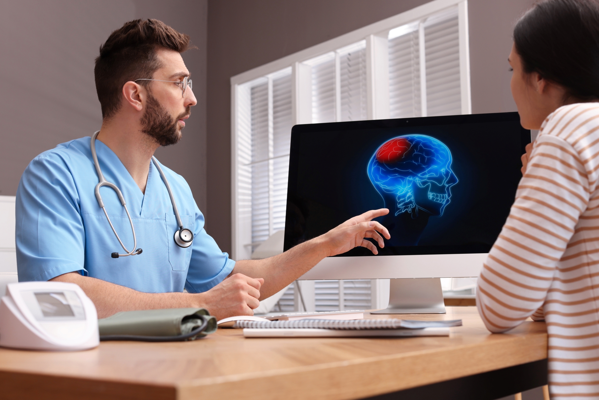 Doctor discussing brain image with patient