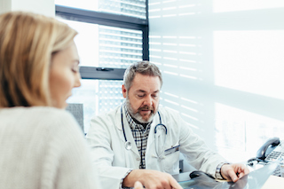 doctor talking with patient