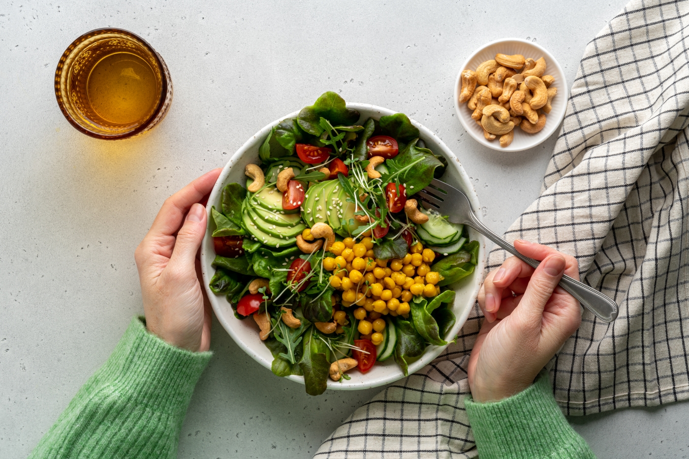 Woman eating vegetable salad
