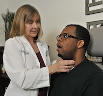 Janis Deane, M.Ed., CCC-SLP, performs laryngeal massage.