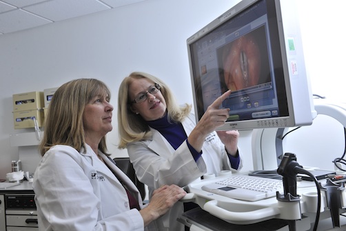 Janis Deane, M.Ed., CCC-SLP, (left) and Barbara Schultz, M.D., (right) look for signs of chronic cough.