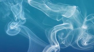 Cigarette smoke on a blue background