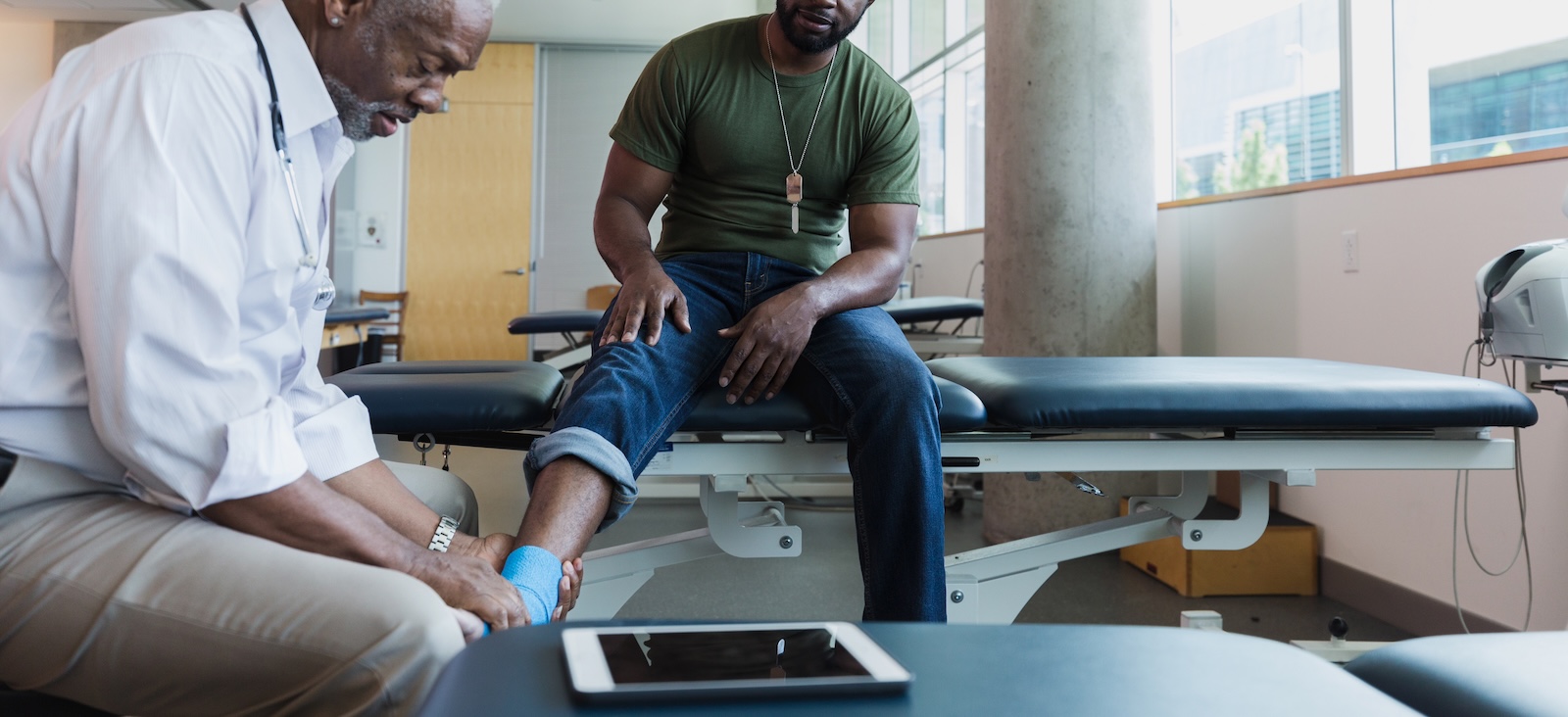 Doctor treating a man's foot