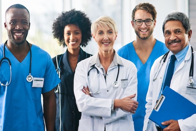 group of doctors all looking directly to camera
