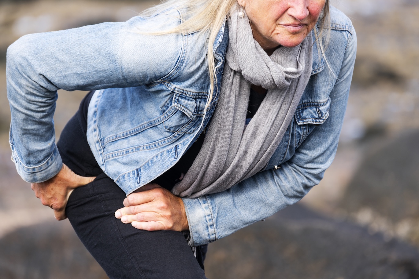 Woman stretching hip and thing