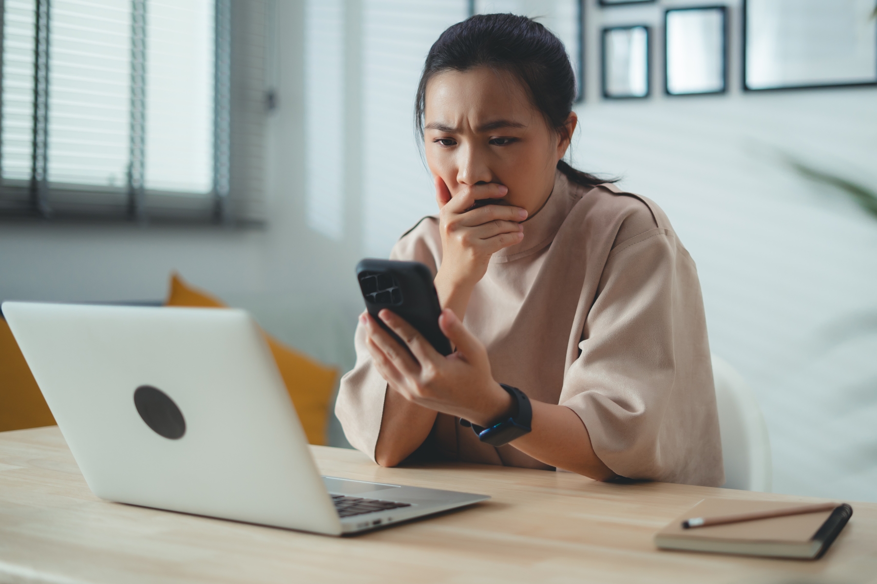 Woman on laptop looking worried