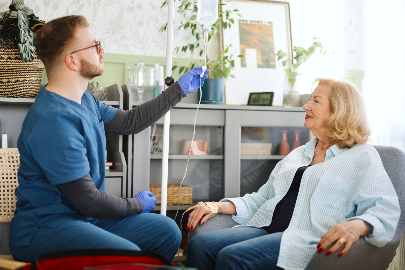 woman getting infusion as nurse adjusts flow
