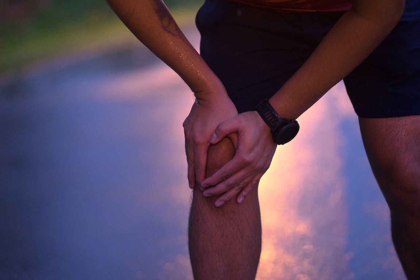 Man Runner injury after workout running in the rain