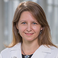 Dr. Una Makris