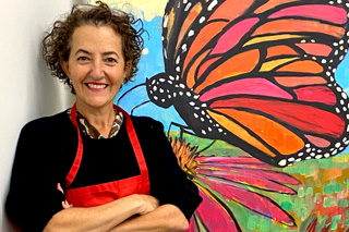 female artist with butterfly painting
