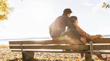 Two people sitting on a bench