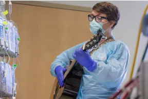 woman playing guitar