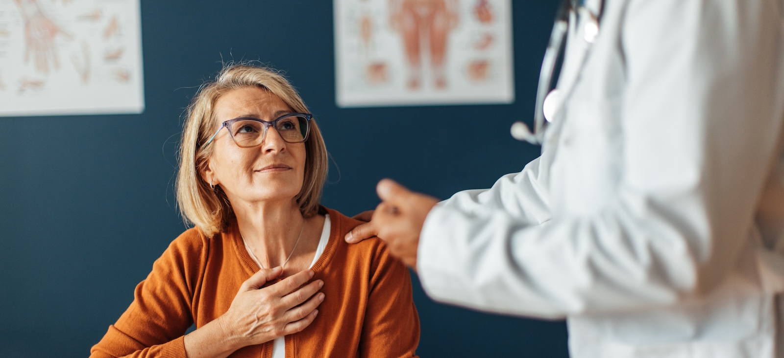 Comforting doctor advising attentive patient
