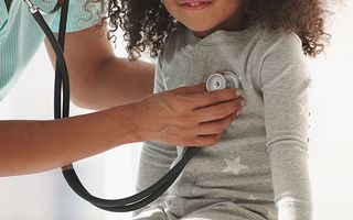 doctor with a stethoscope and a child