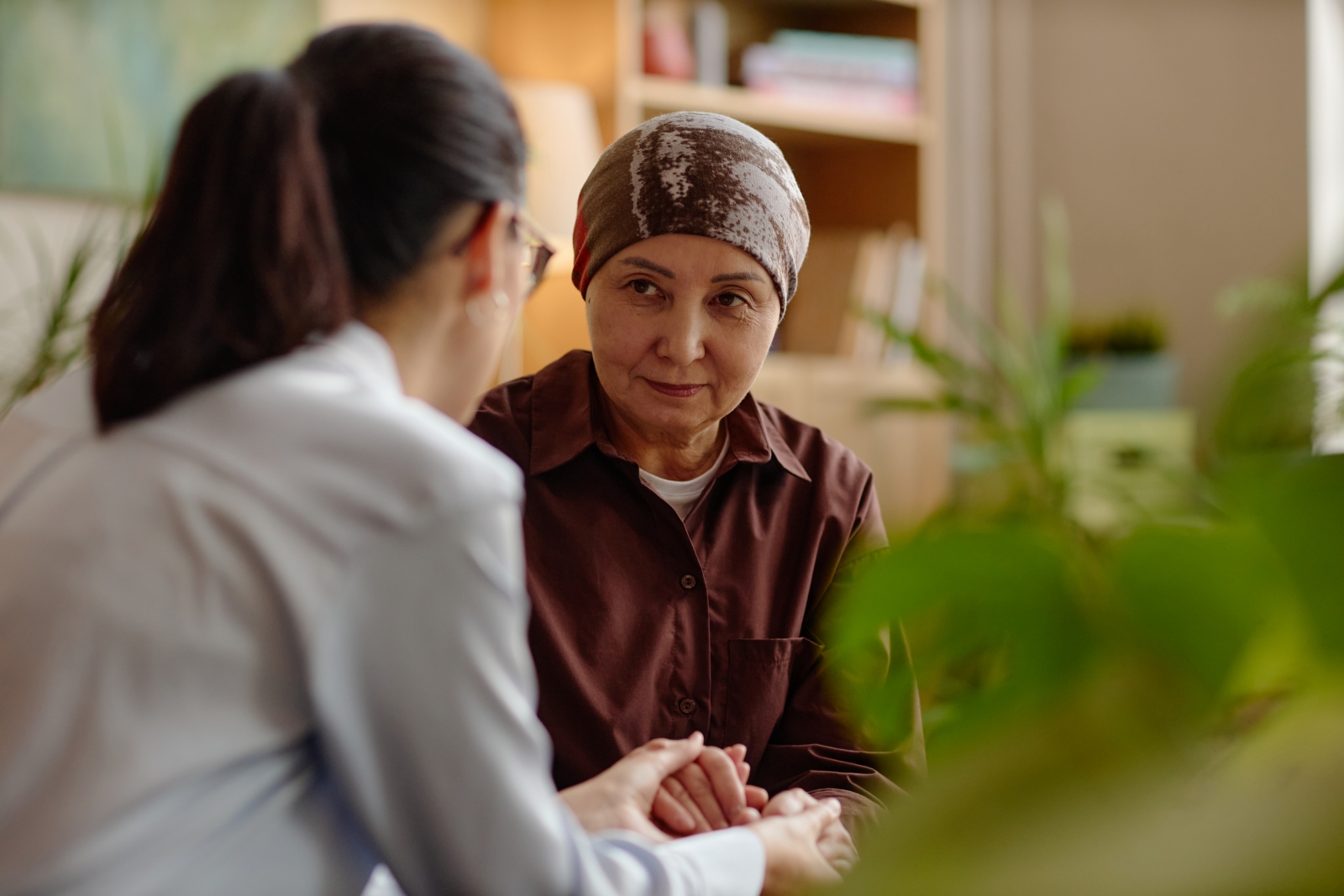 Woman with cancer talking with a therapist