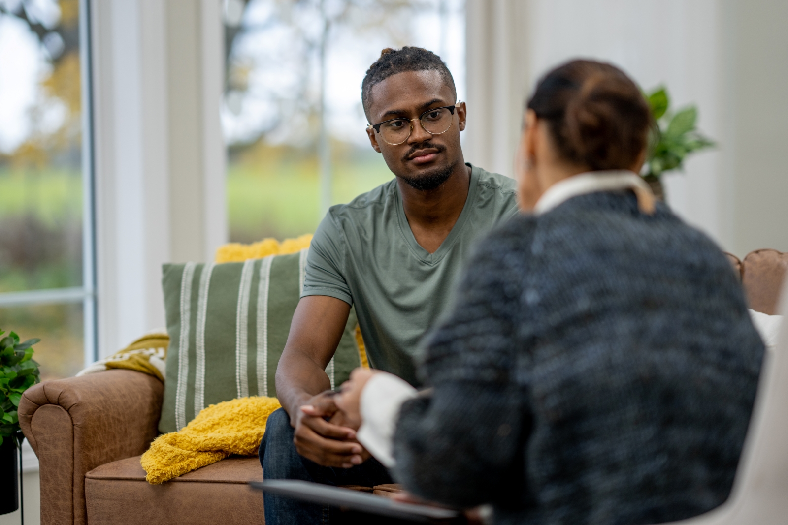 Man talks with a therapist about cancer diagnosis