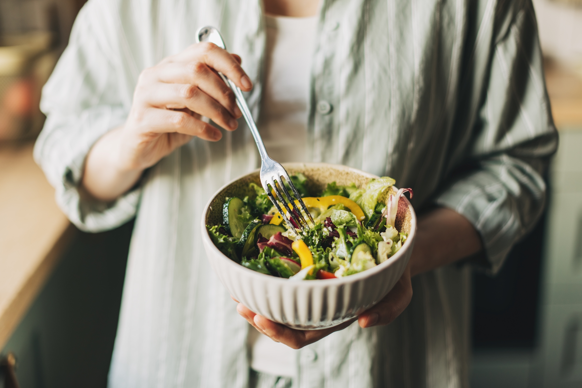 Person holding healthy salad