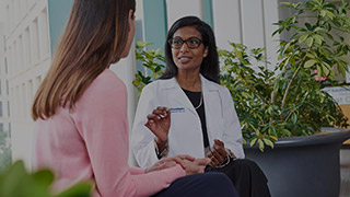A patient consulting with a doctor.