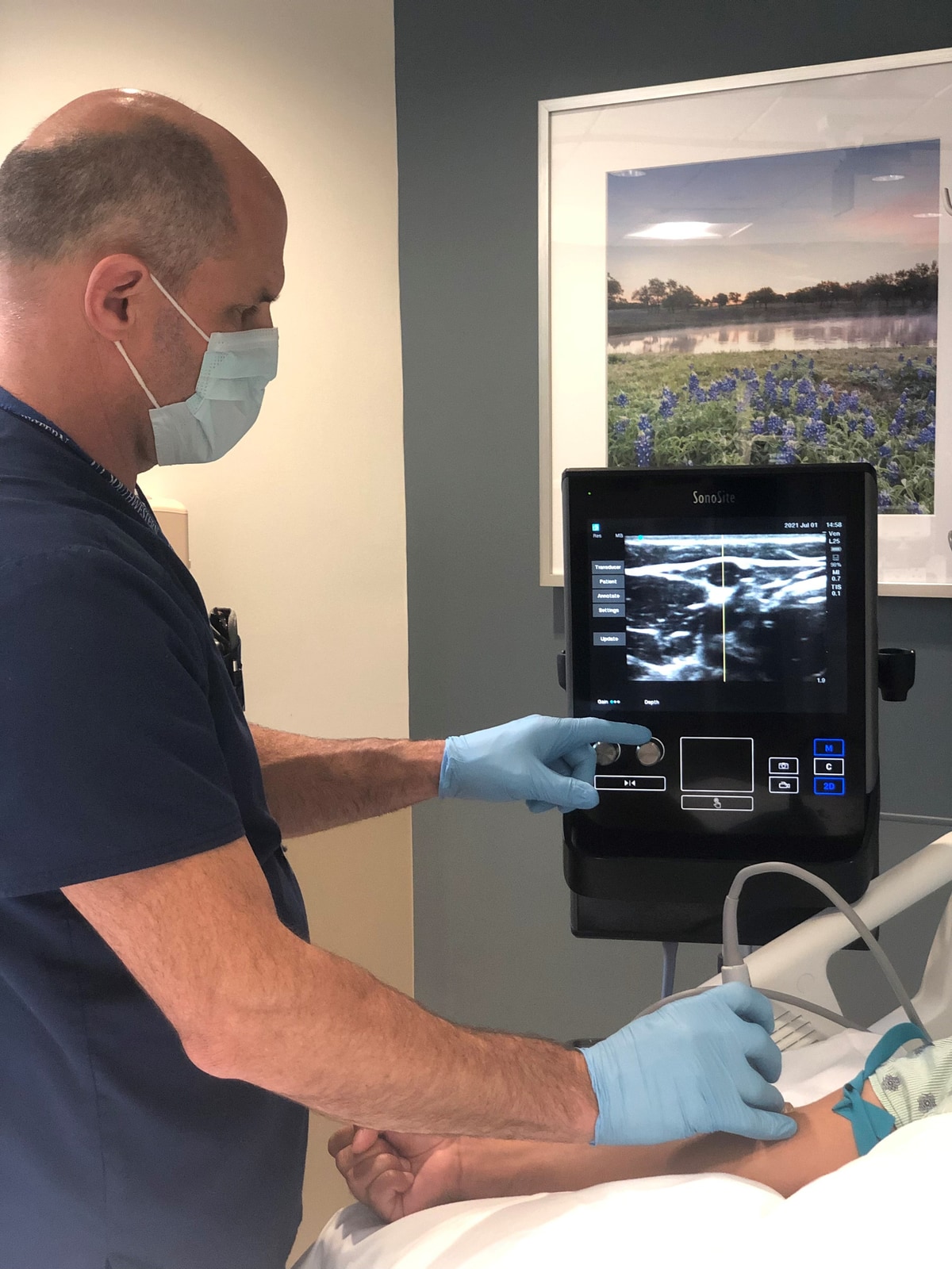 caregiver performing an ultrasound