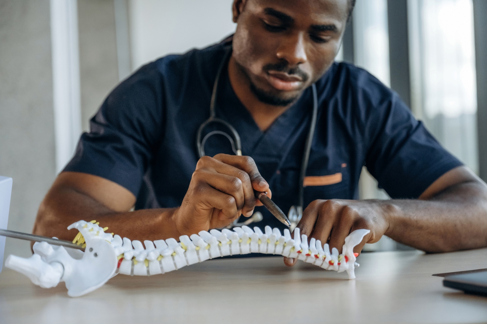 doctor with model of spine