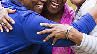 People embracing while smiling