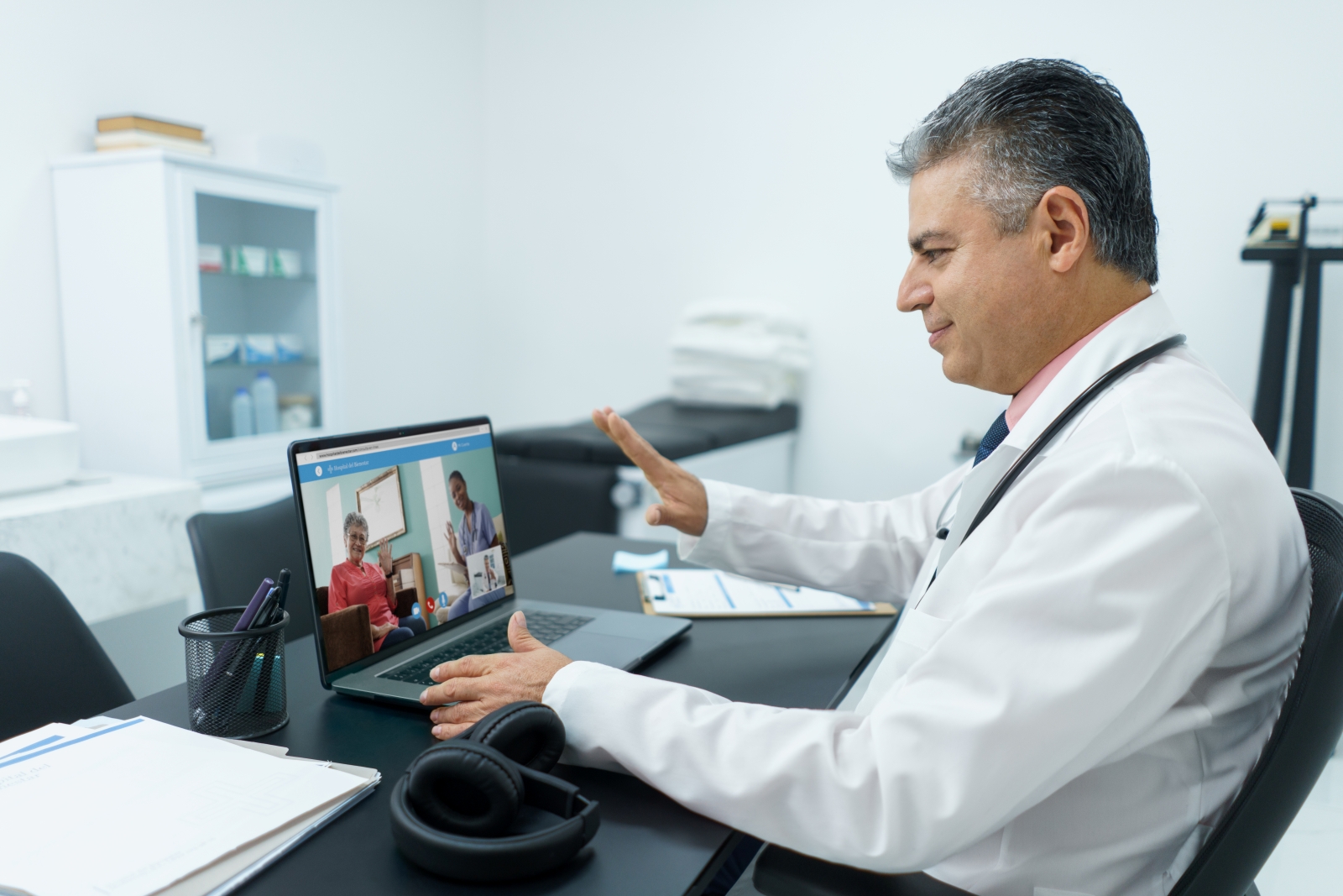 doctor doing virtual visit with a patient on laptop