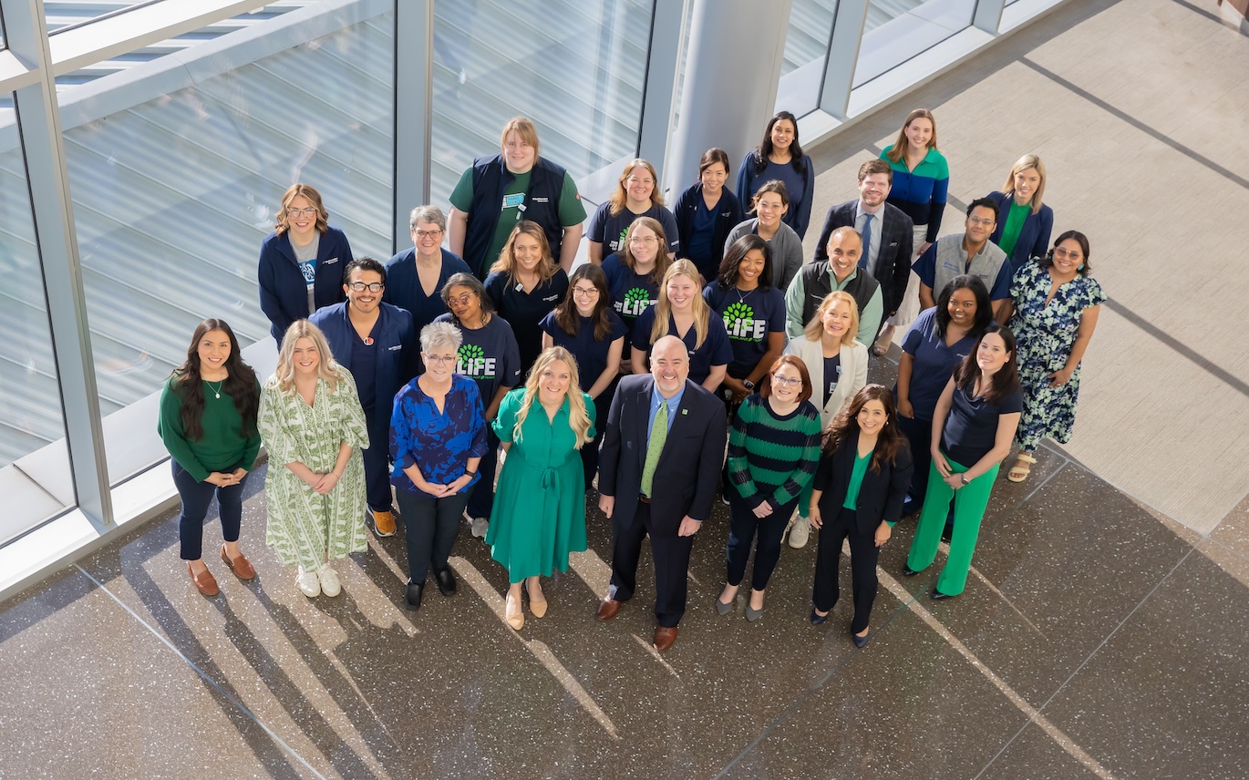Overhead shot of entire transplant team in Clements University Hospital.