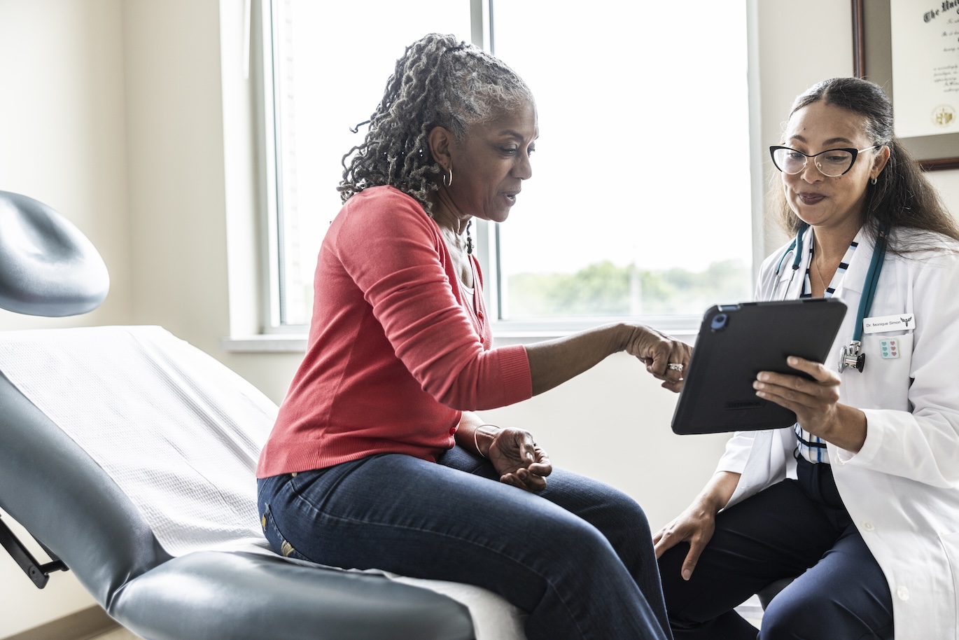 transplant patient consulting with a doctor