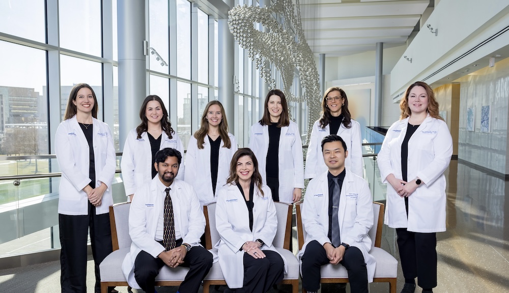 Voice Care team of physicians and specialists standing together in a hospital corridor