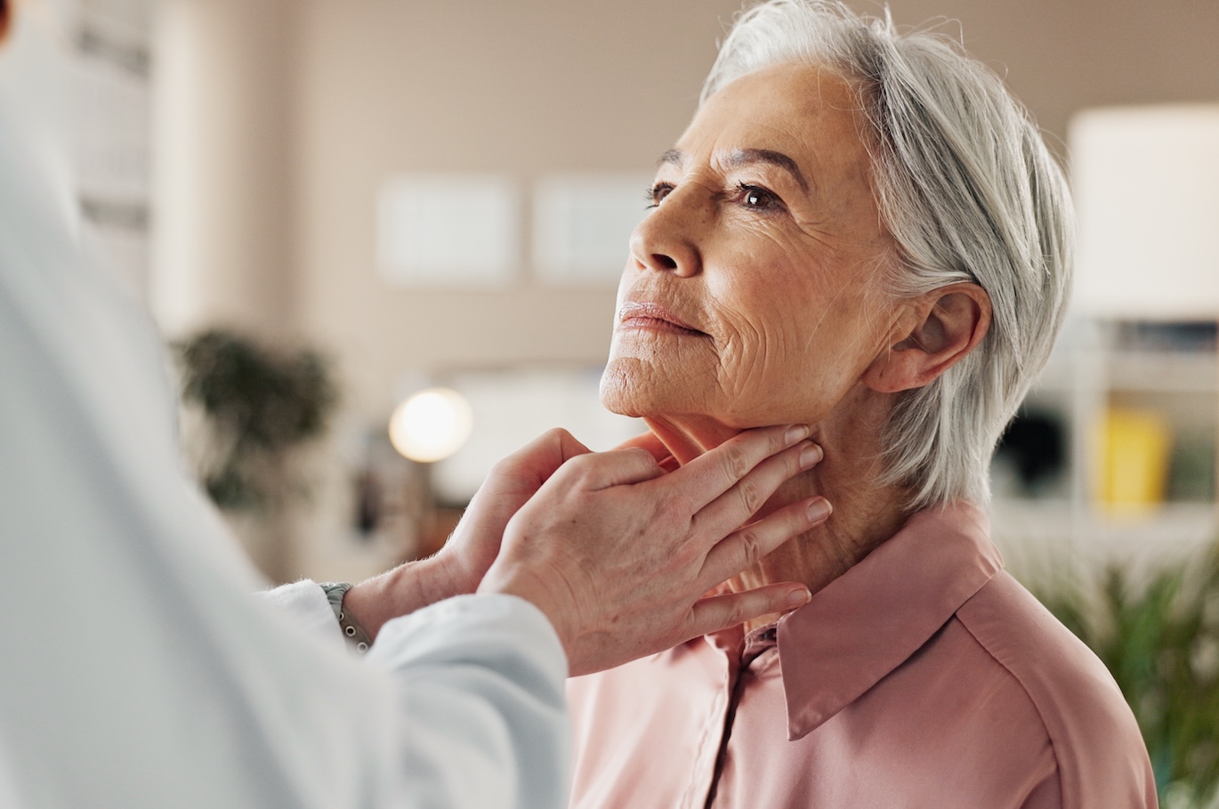 Office, lymph and old woman in consultation with doctor for medical health at senior care clinic